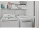 Convenient laundry room with washer, dryer, and overhead storage at 1641 Lake Baldwin Ln, Orlando, FL 32814