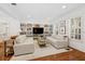 Bright living room with hardwood floors, built-in shelving, and neutral decor at 1641 Lake Baldwin Ln, Orlando, FL 32814