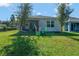 Spacious backyard with covered patio and play area at 1705 Bent Branch Ave, Deland, FL 32720