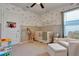 Charming Bedroom with crib, seating and playful decor at 1705 Bent Branch Ave, Deland, FL 32720