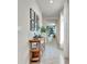 Bright entryway with a console table and picture frames at 1705 Bent Branch Ave, Deland, FL 32720