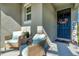 Front porch with wicker chairs and welcoming fall decor at 1705 Bent Branch Ave, Deland, FL 32720