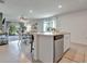 Open kitchen layout with an island and views into the living area at 1705 Bent Branch Ave, Deland, FL 32720