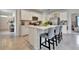 Modern kitchen with white cabinets, stainless steel appliances and an island at 1705 Bent Branch Ave, Deland, FL 32720