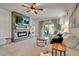 Living room featuring a fireplace and access to the backyard at 1705 Bent Branch Ave, Deland, FL 32720