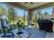 Relaxing patio with a hammock, seating, and a grill at 1705 Bent Branch Ave, Deland, FL 32720