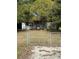 Ranch style home with chain link fence and mature trees at 1721 Grand St, Orlando, FL 32805