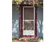 Screen door entry with maroon frame at 1721 Grand St, Orlando, FL 32805