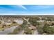 Gated community entrance with lake and surrounding homes at 2556 Volta Cir, Kissimmee, FL 34746