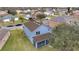 Aerial view of a house showcasing a screened patio and large backyard at 2556 Volta Cir, Kissimmee, FL 34746