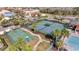Tennis courts, basketball court, and pool create desirable resort style amenities in a lush and landscaped setting at 2556 Volta Cir, Kissimmee, FL 34746