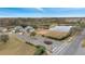 Aerial view showcasing a neighborhood with a lake and playground at 2556 Volta Cir, Kissimmee, FL 34746