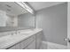 Modern bathroom with double vanity and gray cabinets at 2556 Volta Cir, Kissimmee, FL 34746