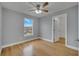 Bright bedroom with wood floors, ceiling fan, and walk-in closet at 2556 Volta Cir, Kissimmee, FL 34746