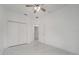 Spacious bedroom with ceiling fan and marble flooring at 2556 Volta Cir, Kissimmee, FL 34746