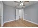 Spacious bedroom featuring hardwood floors and ceiling fan at 2556 Volta Cir, Kissimmee, FL 34746