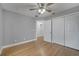 Bedroom with hardwood floors and ceiling fan at 2556 Volta Cir, Kissimmee, FL 34746