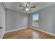 Bedroom with hardwood floors and ceiling fan at 2556 Volta Cir, Kissimmee, FL 34746