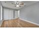 Bright bedroom with hardwood floors and ceiling fan at 2556 Volta Cir, Kissimmee, FL 34746