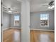 Two bedrooms with hardwood floors and ceiling fans at 2556 Volta Cir, Kissimmee, FL 34746
