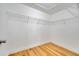 Large walk-in closet with wire shelving and hardwood floors at 2556 Volta Cir, Kissimmee, FL 34746
