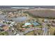 Aerial view of community pool, tennis courts and homes at 2556 Volta Cir, Kissimmee, FL 34746