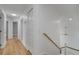 Bright hallway with light wood flooring and doors to bedrooms at 2556 Volta Cir, Kissimmee, FL 34746