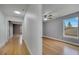 Hallway leading to bedrooms with light wood floors at 2556 Volta Cir, Kissimmee, FL 34746
