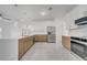 Modern kitchen with stainless steel appliances and large island at 2556 Volta Cir, Kissimmee, FL 34746
