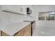 Modern kitchen with white cabinets, quartz countertops, and gold accents at 2556 Volta Cir, Kissimmee, FL 34746