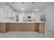 Modern kitchen with light wood cabinets and white countertops at 2556 Volta Cir, Kissimmee, FL 34746