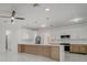 Modern kitchen featuring a large island and stainless steel appliances at 2556 Volta Cir, Kissimmee, FL 34746