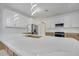 Modern kitchen with a large island and a gold faucet at 2556 Volta Cir, Kissimmee, FL 34746
