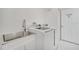 Laundry room with stainless steel sink and new appliances at 2556 Volta Cir, Kissimmee, FL 34746