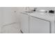 Laundry room features a washer, dryer, and marble-look floors at 2556 Volta Cir, Kissimmee, FL 34746