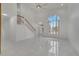 Bright living room featuring high ceilings, marble floors, and a grand window at 2556 Volta Cir, Kissimmee, FL 34746