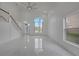 Bright and airy living room with high ceilings, marble floors, and large windows at 2556 Volta Cir, Kissimmee, FL 34746