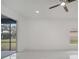 Spacious living area with marble floors and access to a screened patio at 2556 Volta Cir, Kissimmee, FL 34746