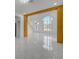 Open concept living room with high ceilings and a large window at 2556 Volta Cir, Kissimmee, FL 34746