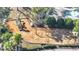 Aerial view of the community playground featuring swings, a slide, and mature landscaping at 2556 Volta Cir, Kissimmee, FL 34746