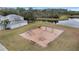 Community playground with swings and climbing equipment near a lake at 2556 Volta Cir, Kissimmee, FL 34746