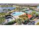 Community amenities include pool, pool, splash pad, lounge seating, and verdant landscaping at 2556 Volta Cir, Kissimmee, FL 34746