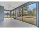 Spacious screened porch with ceiling fan, offering a relaxing outdoor space at 2556 Volta Cir, Kissimmee, FL 34746