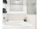 Relaxing bathroom featuring a large soaking tub and modern fixtures at 260 S Osceola Ave # 1611, Orlando, FL 32801