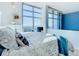 Bright bedroom with a large bed, city view, and plenty of natural light at 260 S Osceola Ave # 1611, Orlando, FL 32801