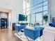 Spacious living room with floor-to-ceiling windows, hardwood floors, and stylish furnishings at 260 S Osceola Ave # 1611, Orlando, FL 32801