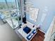 High-ceiling living room with a chic, modern design and hardwood floors at 260 S Osceola Ave # 1611, Orlando, FL 32801