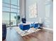 Modern living room featuring floor to ceiling windows and city views at 260 S Osceola Ave # 1611, Orlando, FL 32801