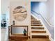 Modern staircase with contemporary art and wooden steps at 260 S Osceola Ave # 1611, Orlando, FL 32801