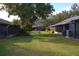 Landscaped backyard with grassy area at 2912 Squire Oak Ct, St Cloud, FL 34769
